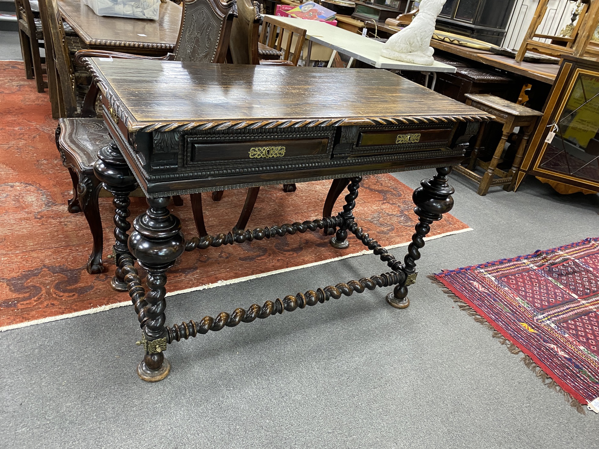 A 19th century Portuguese table, raised on turned twisted supports and stretchers, width 115cm, depth 59cm, height 82cm